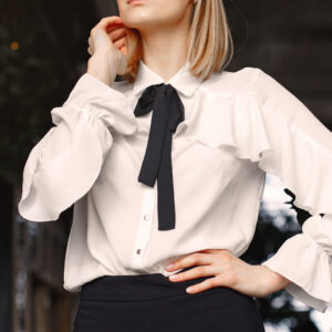 Beautiful woman working. Busineswoman in a stylish clothes. Woman standing in the office.